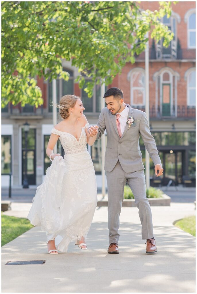 bride and groom dancing together in downtown Tiffin, Ohio square