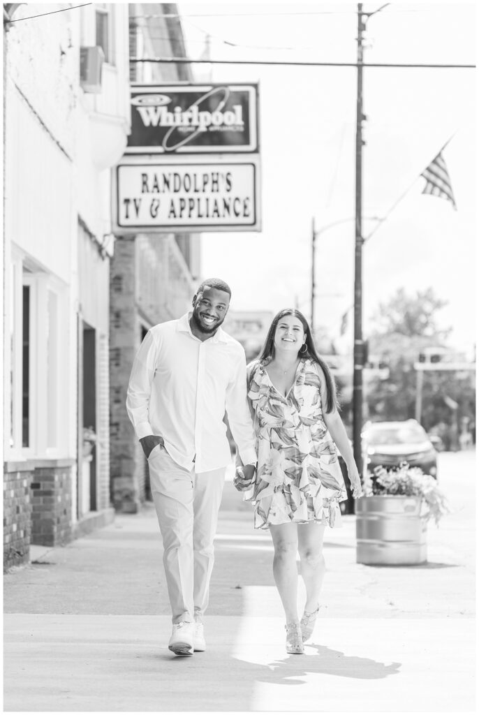 engaged couple walking down the sidewalk in Gibsonburg