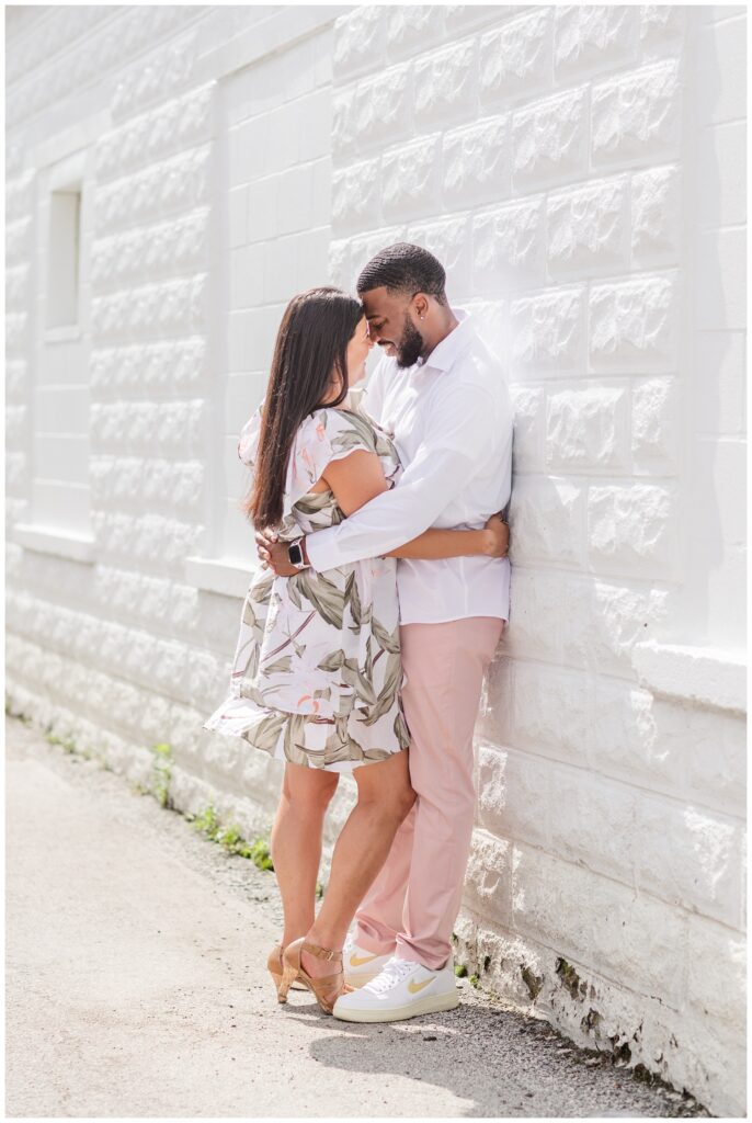 couple standing against a white wall in Gibsonburg, OHio
