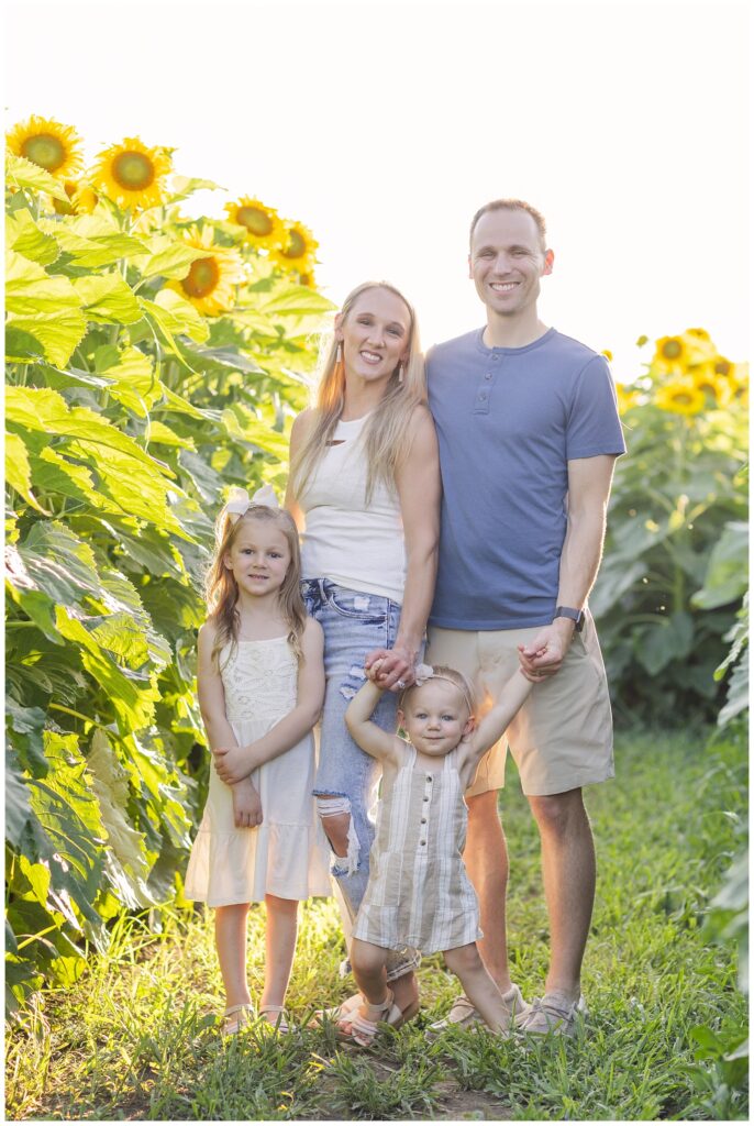 family standing in a sunflower field in Lindsey, Ohio
