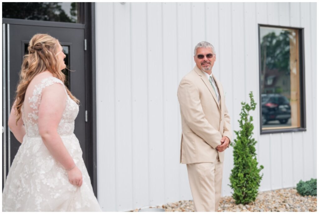 bride's first look with stepdad at the Village Barn wedding venue