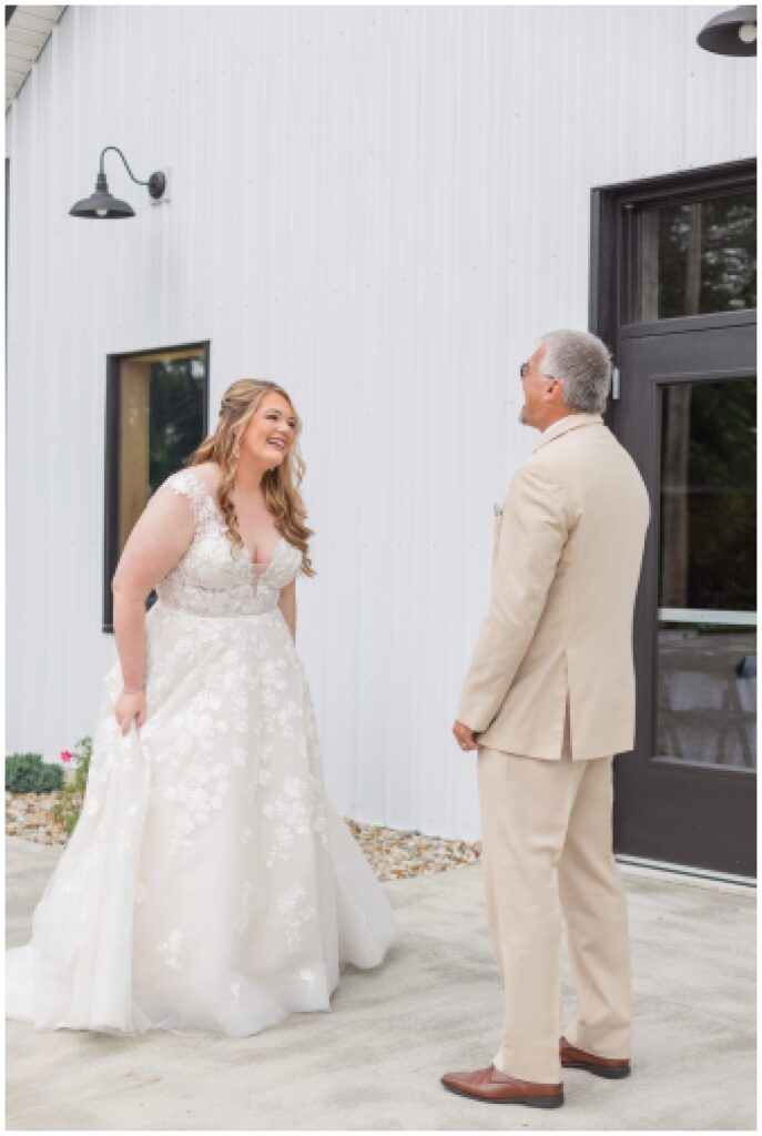 bride's first look with stepdad at the Village Barn wedding venue