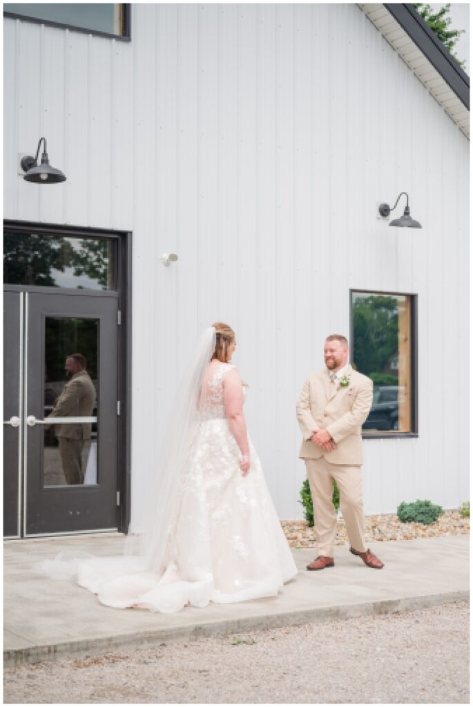 bride and groom's first look at Monroeville, Ohio wedding venue
