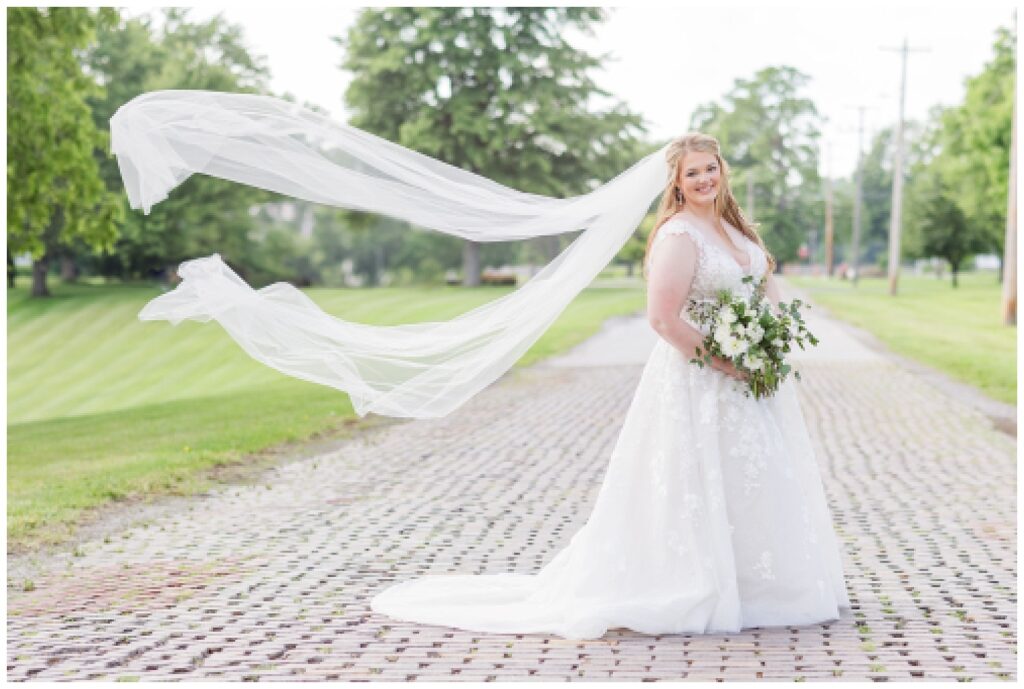 bride portraits with veil flowing up in the air in Monroeville, Ohio