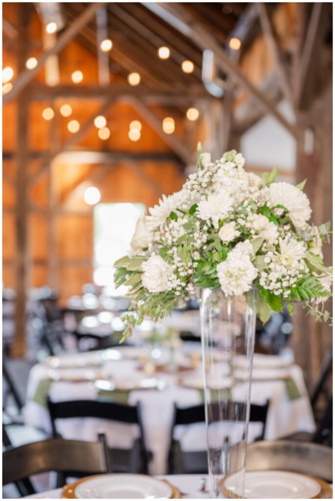 floral table centerpieces at summer wedding at the Village Barn
