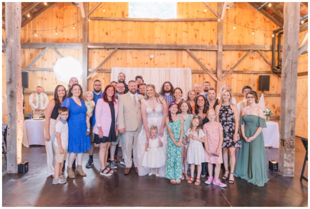group photo of wedding couple and guests at the Village Barn in Ohio
