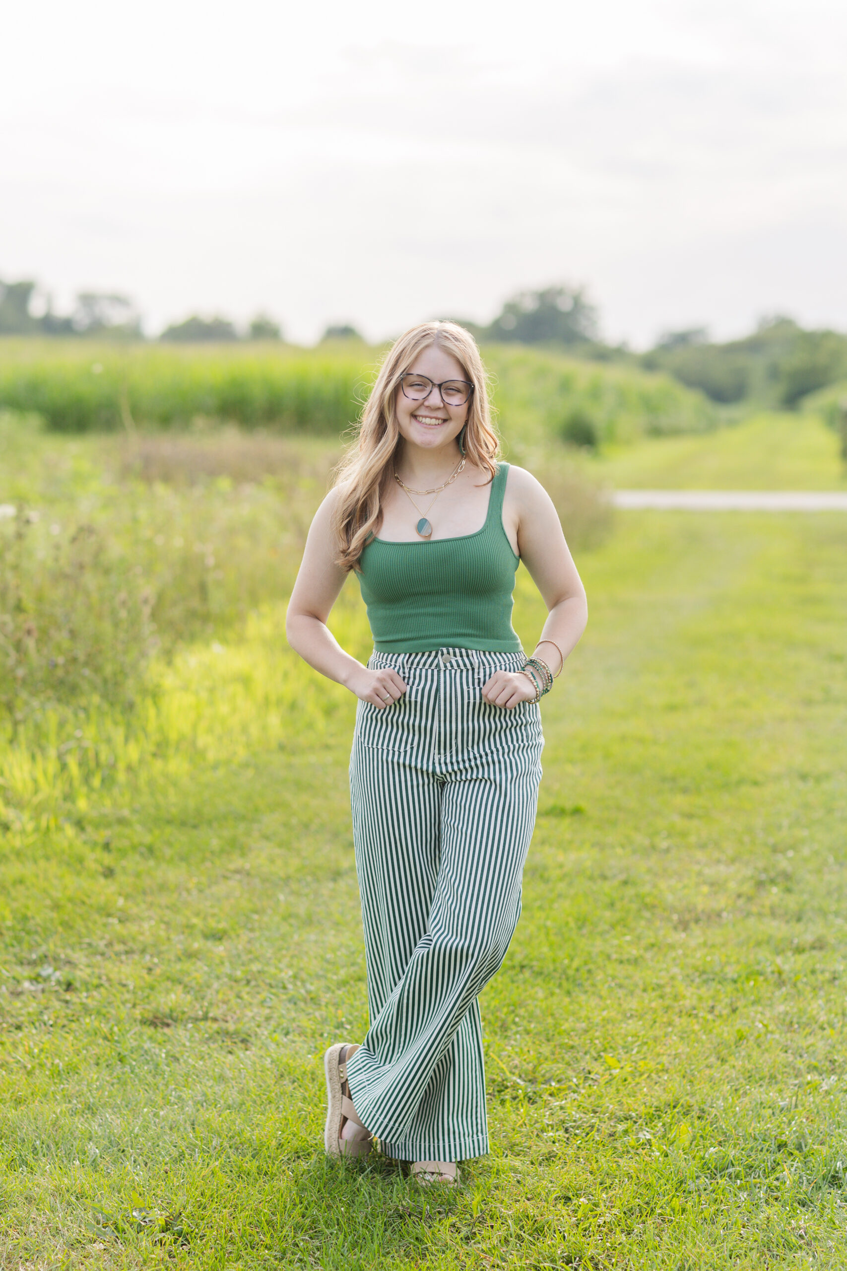high school senior posing near a field in Ohio