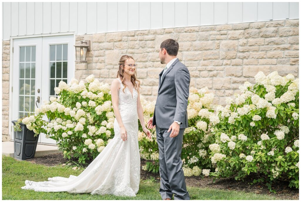 first look with bride and groom outside at Arlington Acres