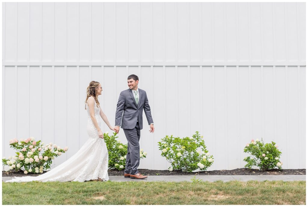 bride and groom walking together at Fremont, Ohio wedding venue