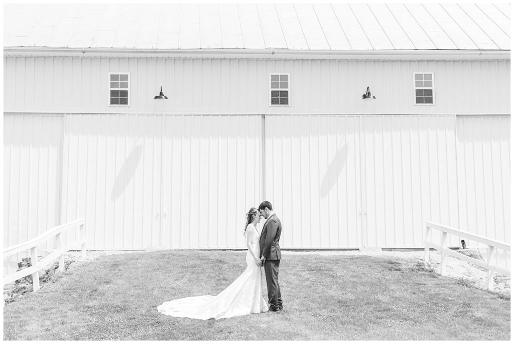 groom and bride touching foreheads outside at Tiffin, Ohio wedding venue