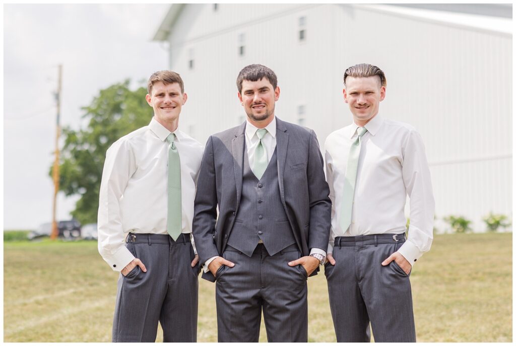 groomsmen posing on the grounds of Tiffin, Ohio wedding venue