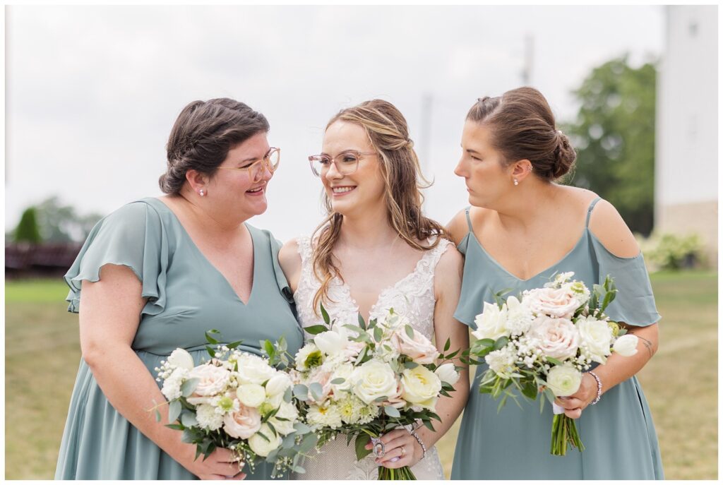 bridal party holding bouquets at summer wedding in northwest Ohio