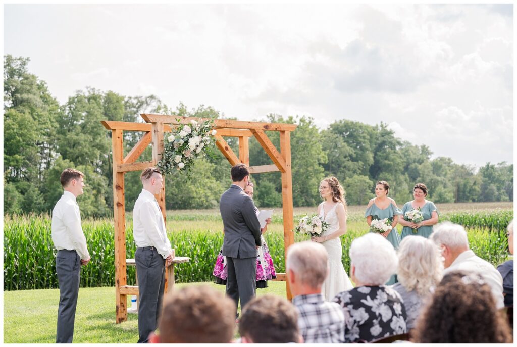 wedding couple at outdoor ceremony a rustic barn venue
