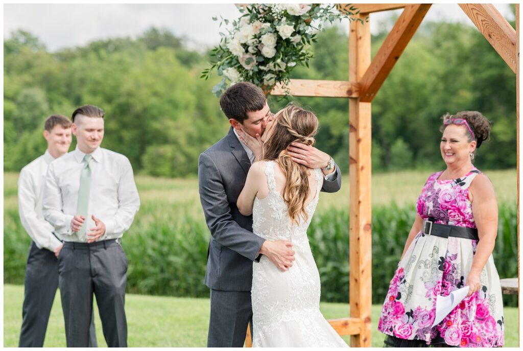 bride and groom kissing at end of ceremony at Tiffin, Ohio wedding