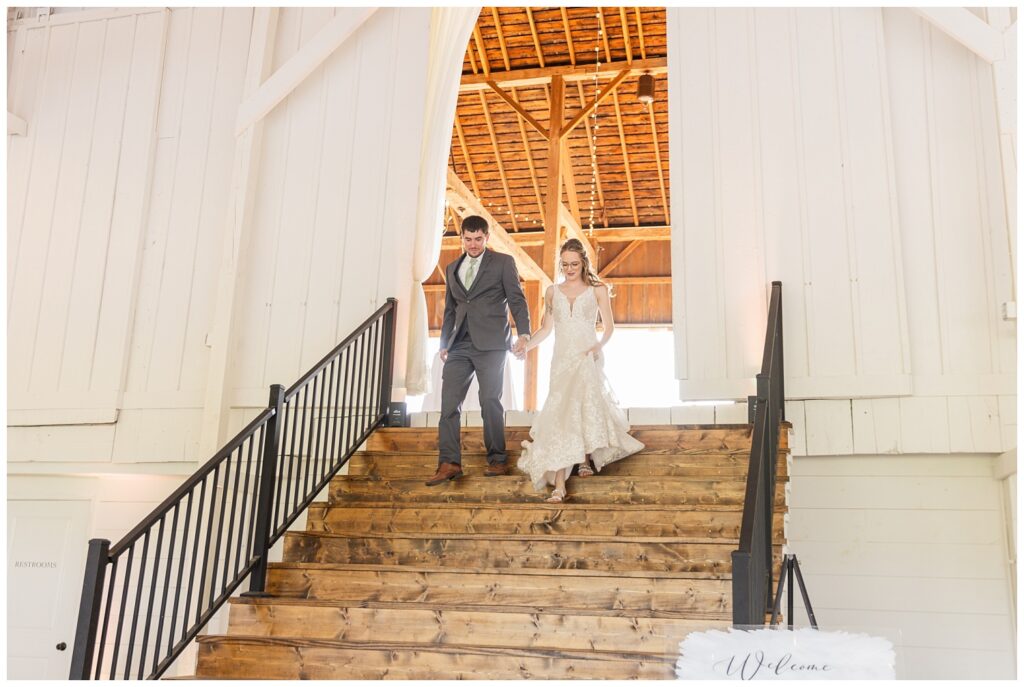 bride and groom walking into their reception at Arlington Acres