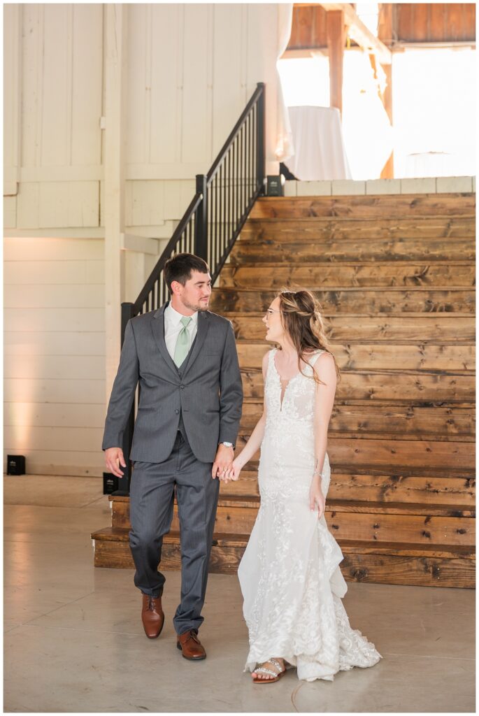 bride and groom making grand entrance into reception at Arlington Acres
