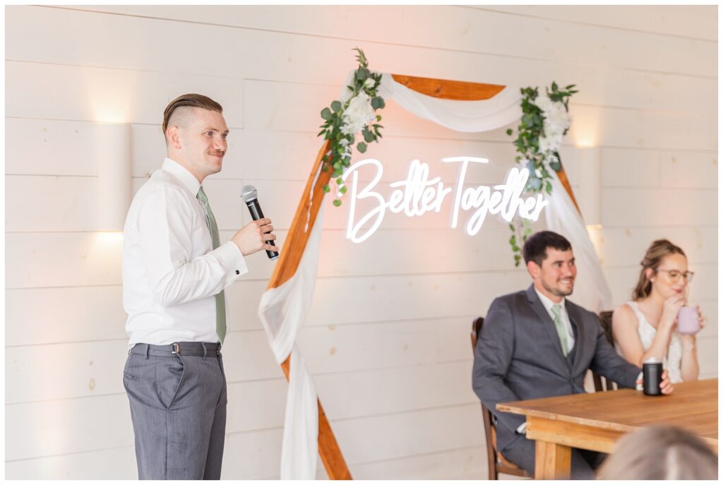 best man giving toast at rustic barn venue reception in northwest Ohio