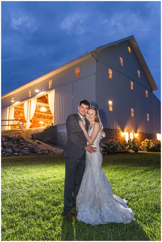 wedding couple posing together at night outside at Tiffin, Ohio venue