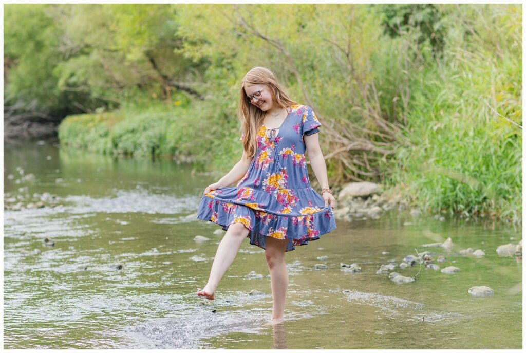 senior playing with water in a creek in northeast Ohio session