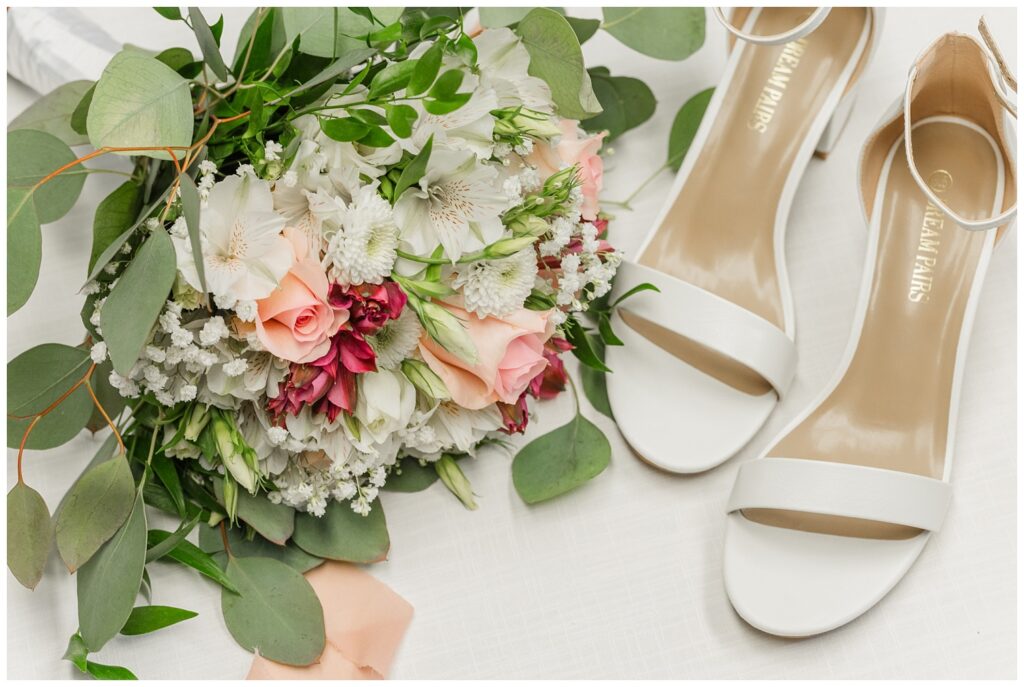 bride's bouquet sitting next to her white sandals at fall wedding in Ohio