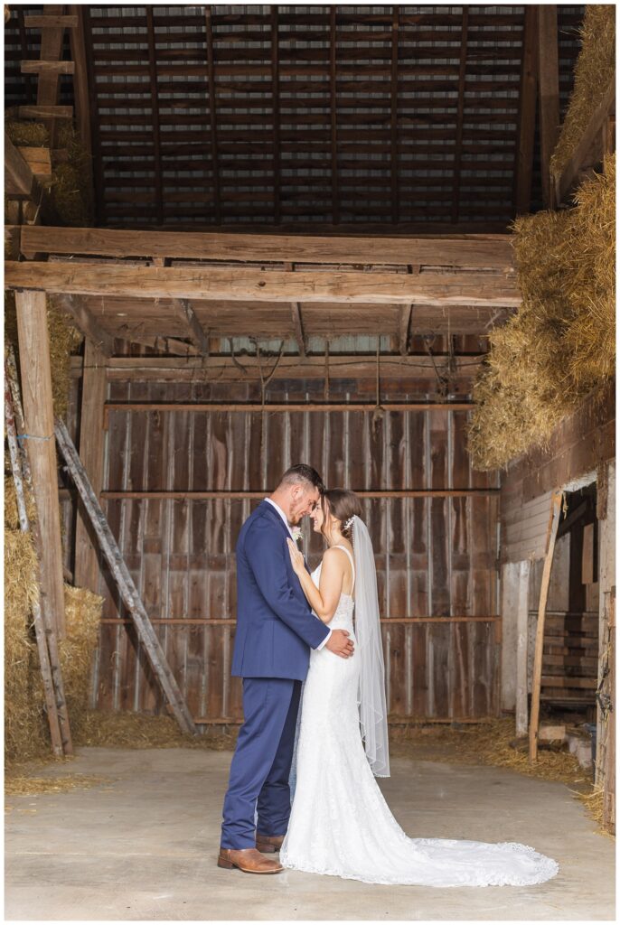 wedding couple posing inside their barn in Bowling Green, Ohio