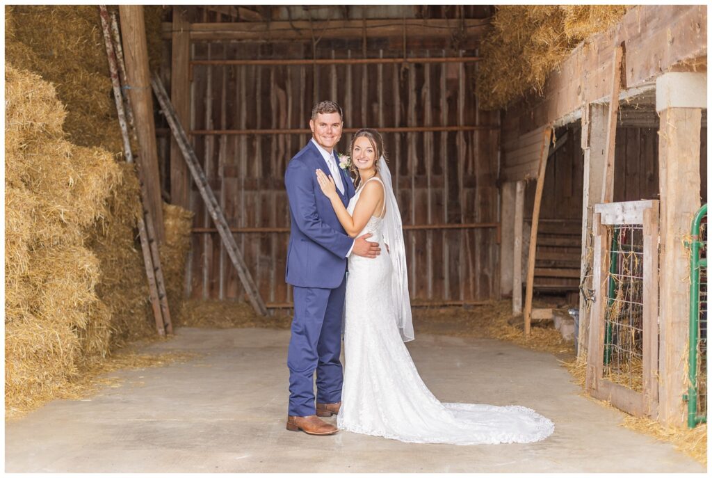 wedding couple posing inside their barn in Bowling Green, Ohio