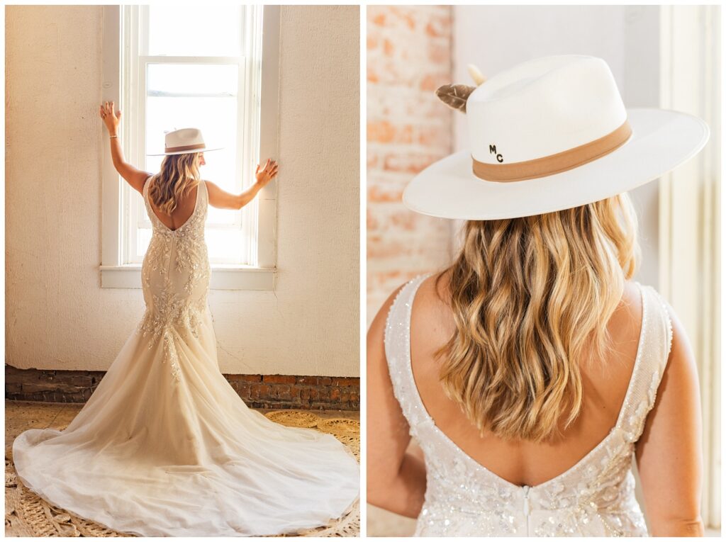bride posing in front of a long window wearing her wedding dress and ivory cowboy hat