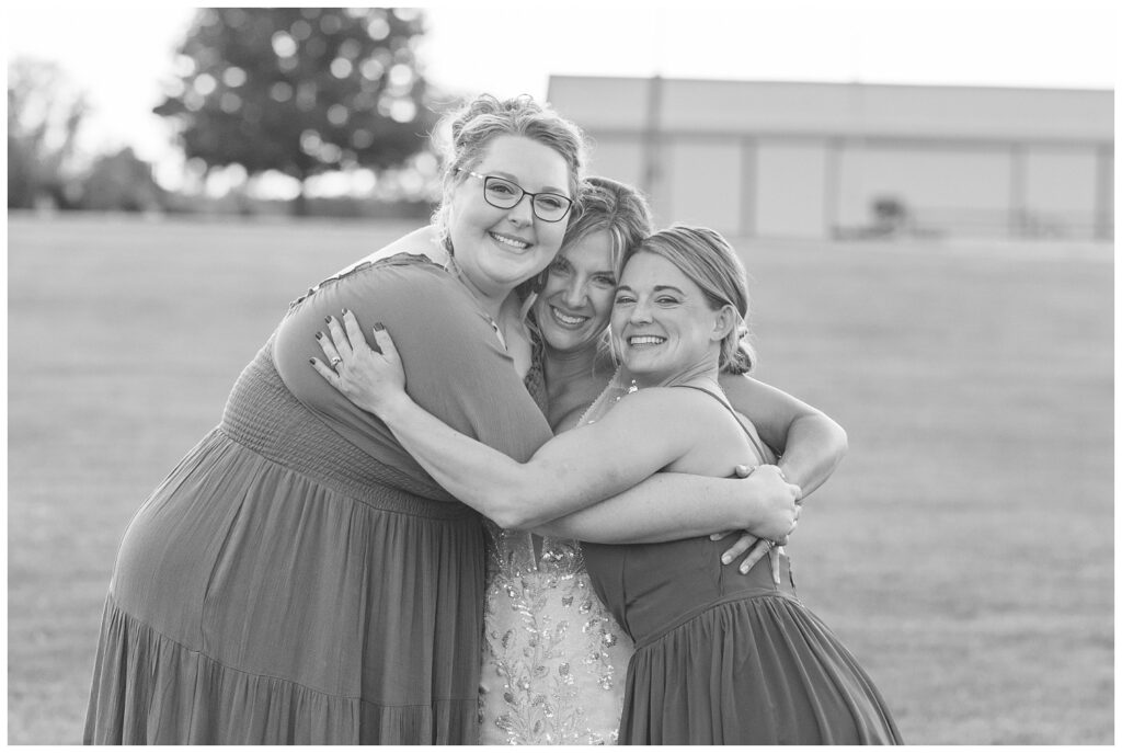 bride posing with her two best friends at Gibsonburg, Ohio wedding