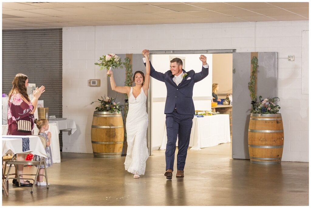 wedding couple making reception entrance at Woods County Fairgrounds