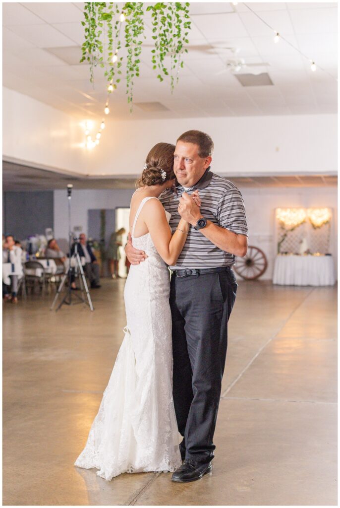 bride dancing with one of her uncles at fall wedding reception in northwest Ohio