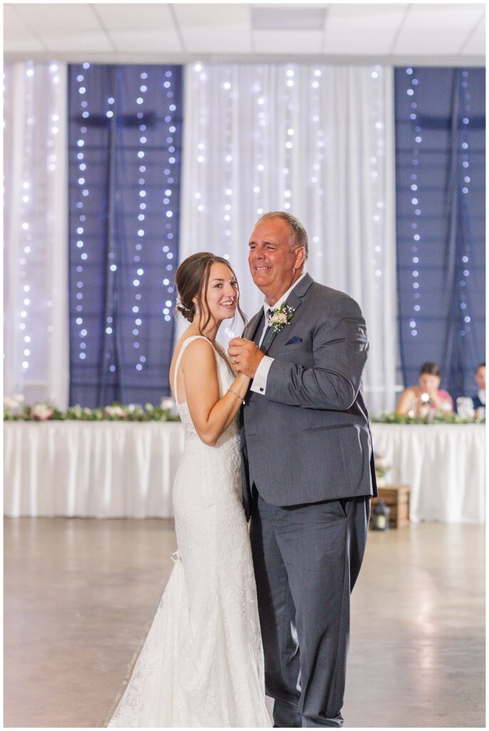 bride having dance with stepdad at fall wedding reception in northwest Ohio
