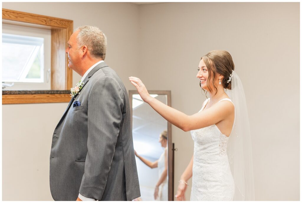 first look between the bride and her stepdad at Risingsun First Church of God
