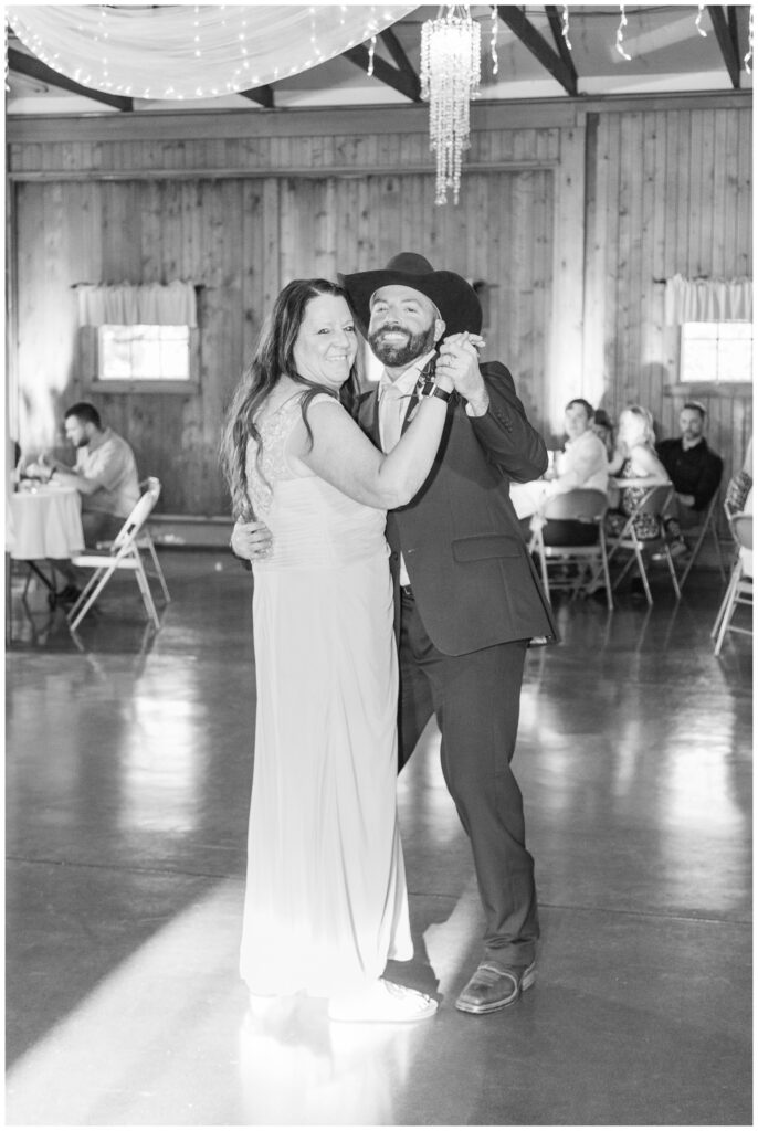 groom and mom share dance at wedding reception at Ole Zim’s Wagon Shed wedding venue 