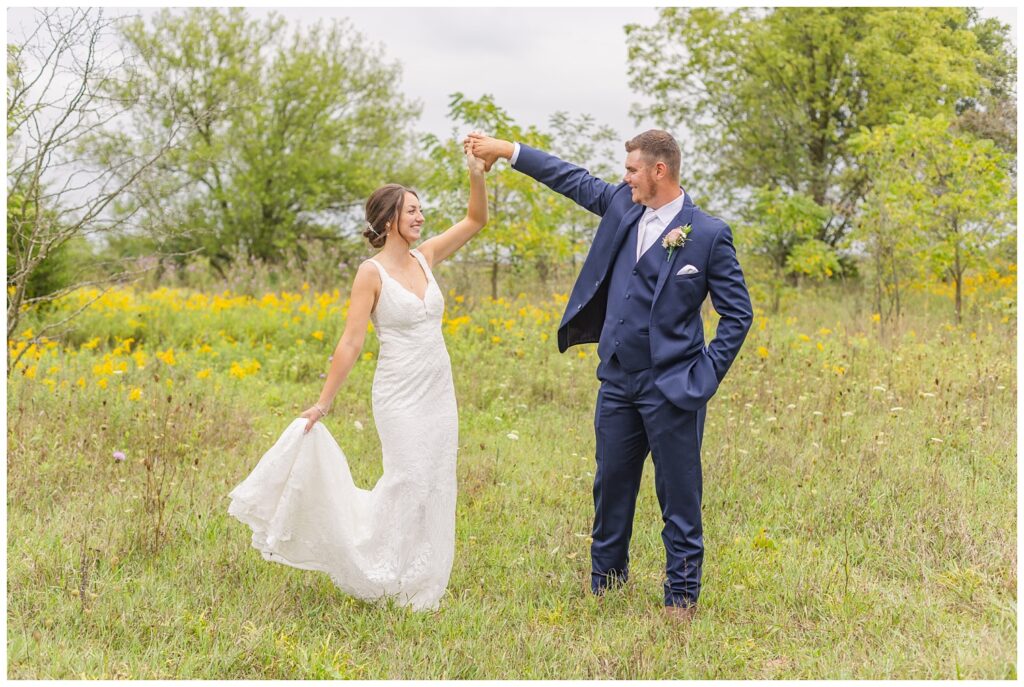 bride and groom dance together in their farm in northwest Ohio