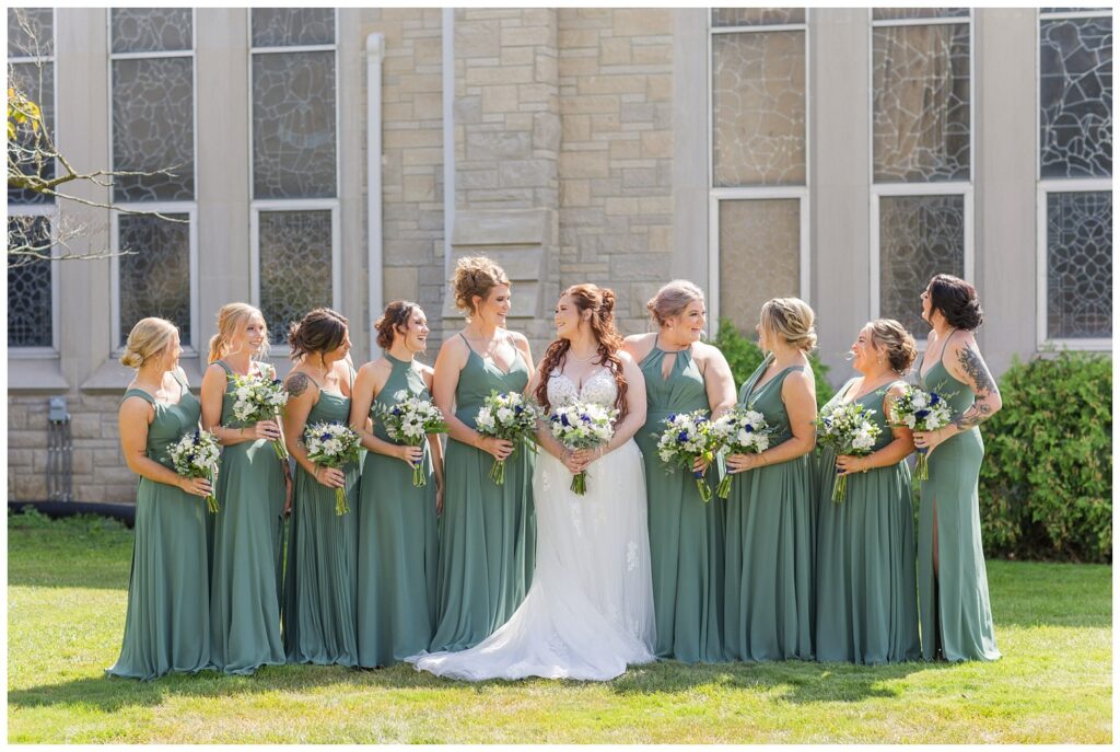 bride laughing with bridal party at northwest Ohio wedding 