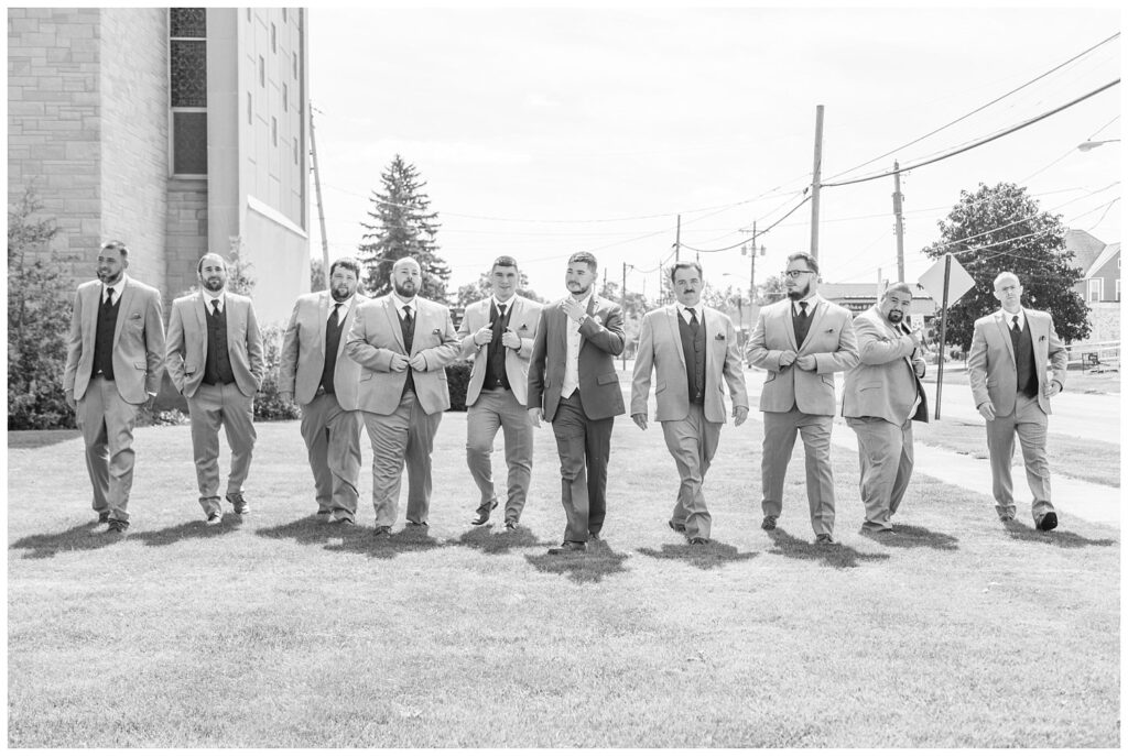 groomsmen walking together outside the church in northwest Ohio wedding