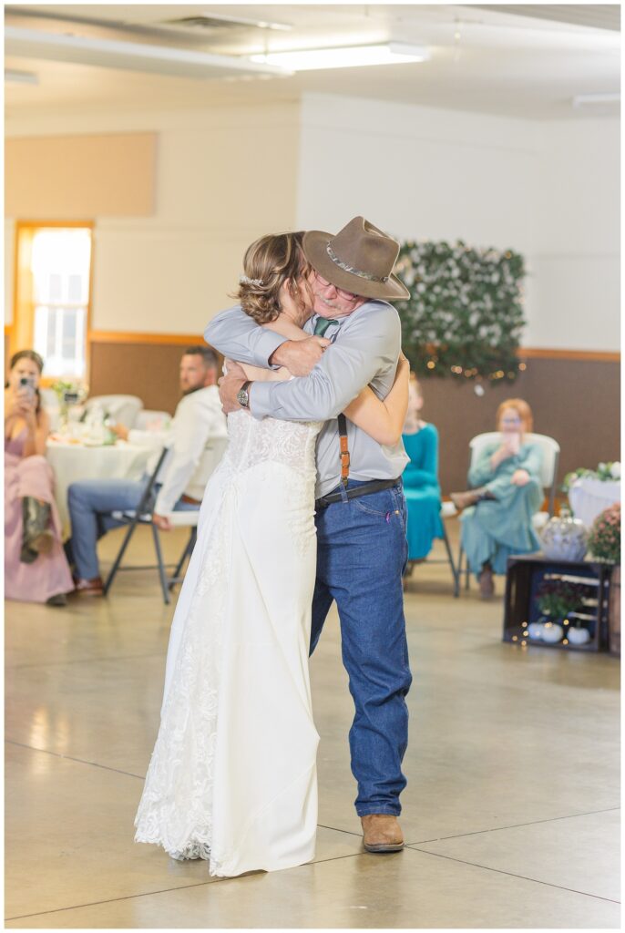 bride hugging her dad at wedding reception in Huron County Ohio