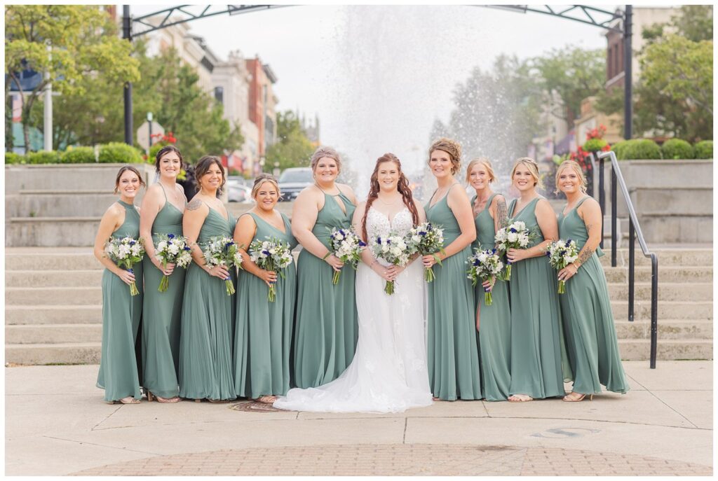 bridal party posing in front of the stairs and fountain in downtown Sandusky Ohio
