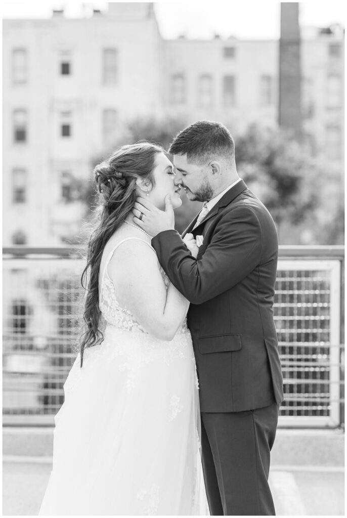 bride and groom share a kiss in downtown Sandusky, Ohio