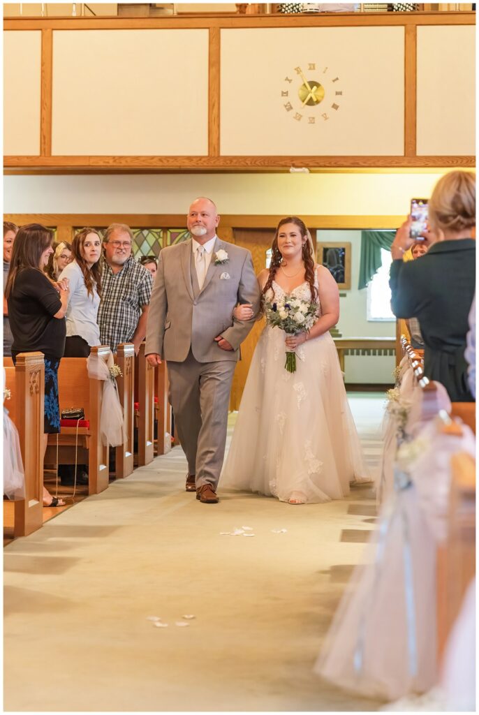 bride walking down the aisle with her dad at Lutheran church wedding in Ohio