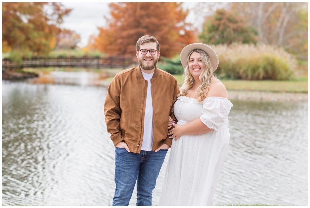 couple posing together near a bridge in a park in northwest Ohio