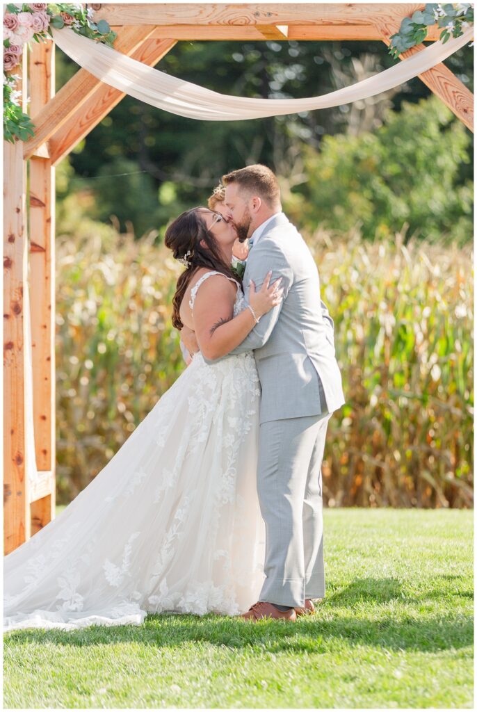 couple kiss after ceremony at Arlington Acres