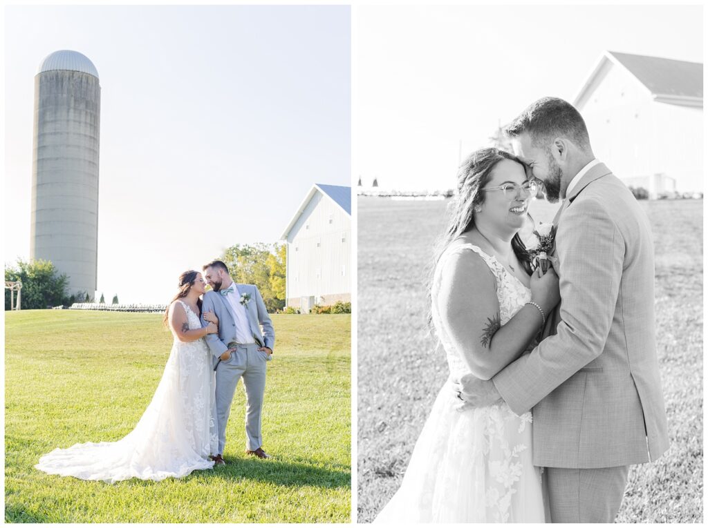 bride and groom posing in front of white barn venue in northwest Ohio