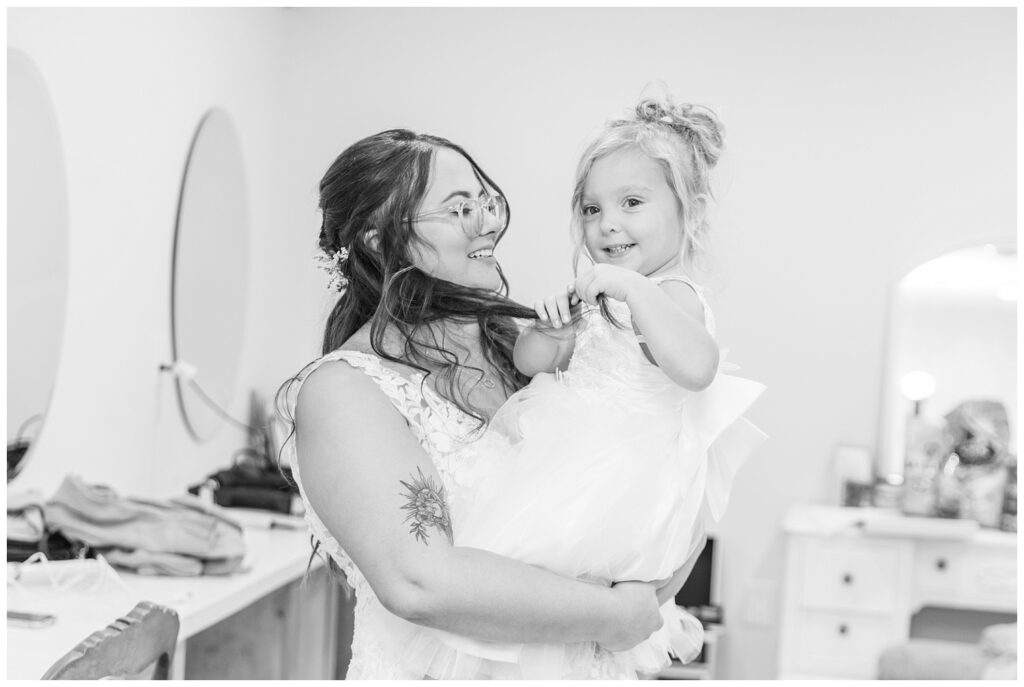 bride holding her daughter after getting ready for wedding in Tiffin, Ohio