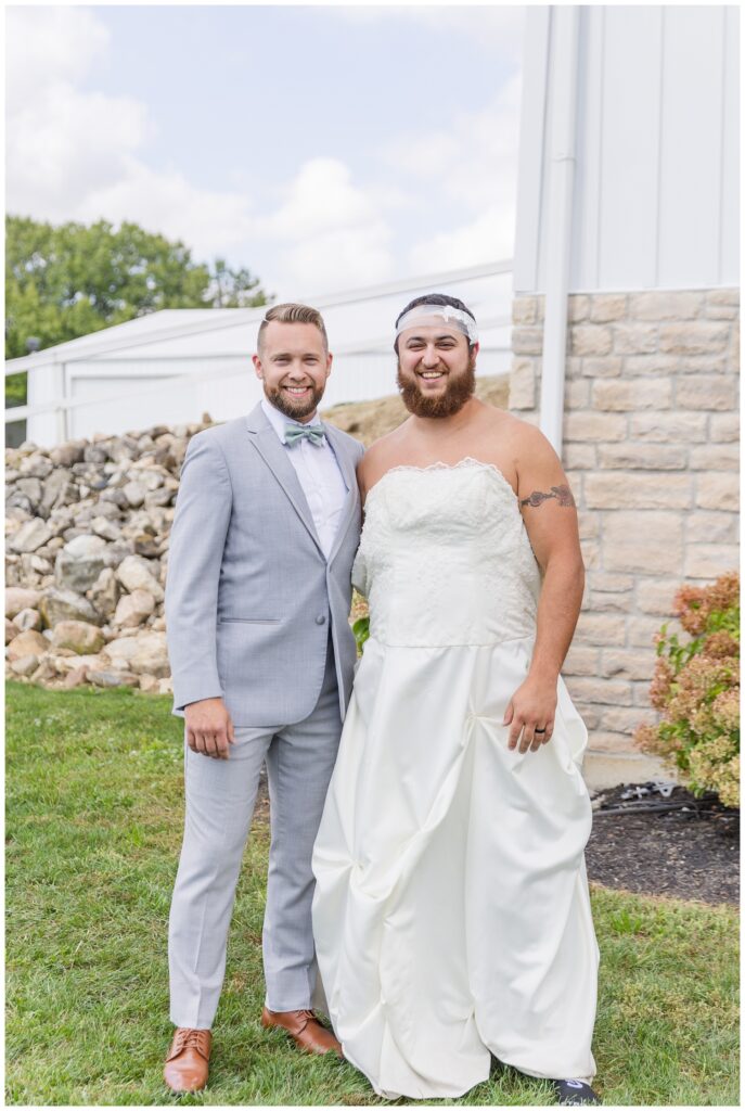 groom posing with best man after fake first look at Arlington Acres