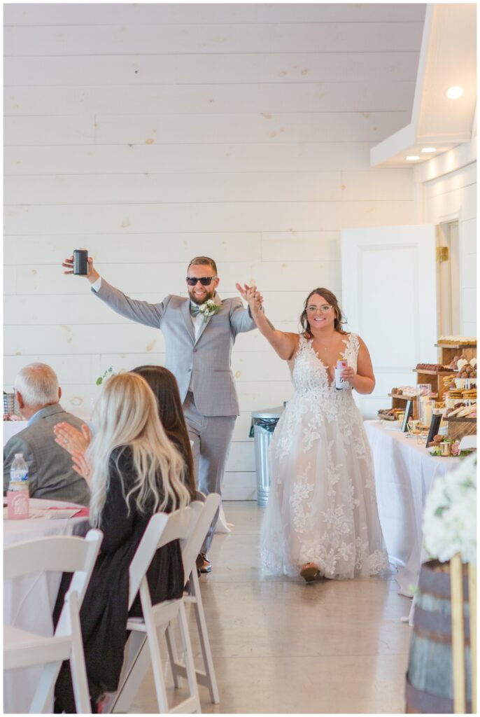 bride and groom make entrance into reception venue in Tiffin Ohio