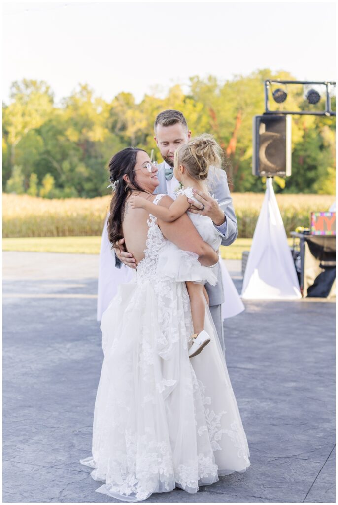 wedding couple have dance with their daughter at Arlington Acres venue