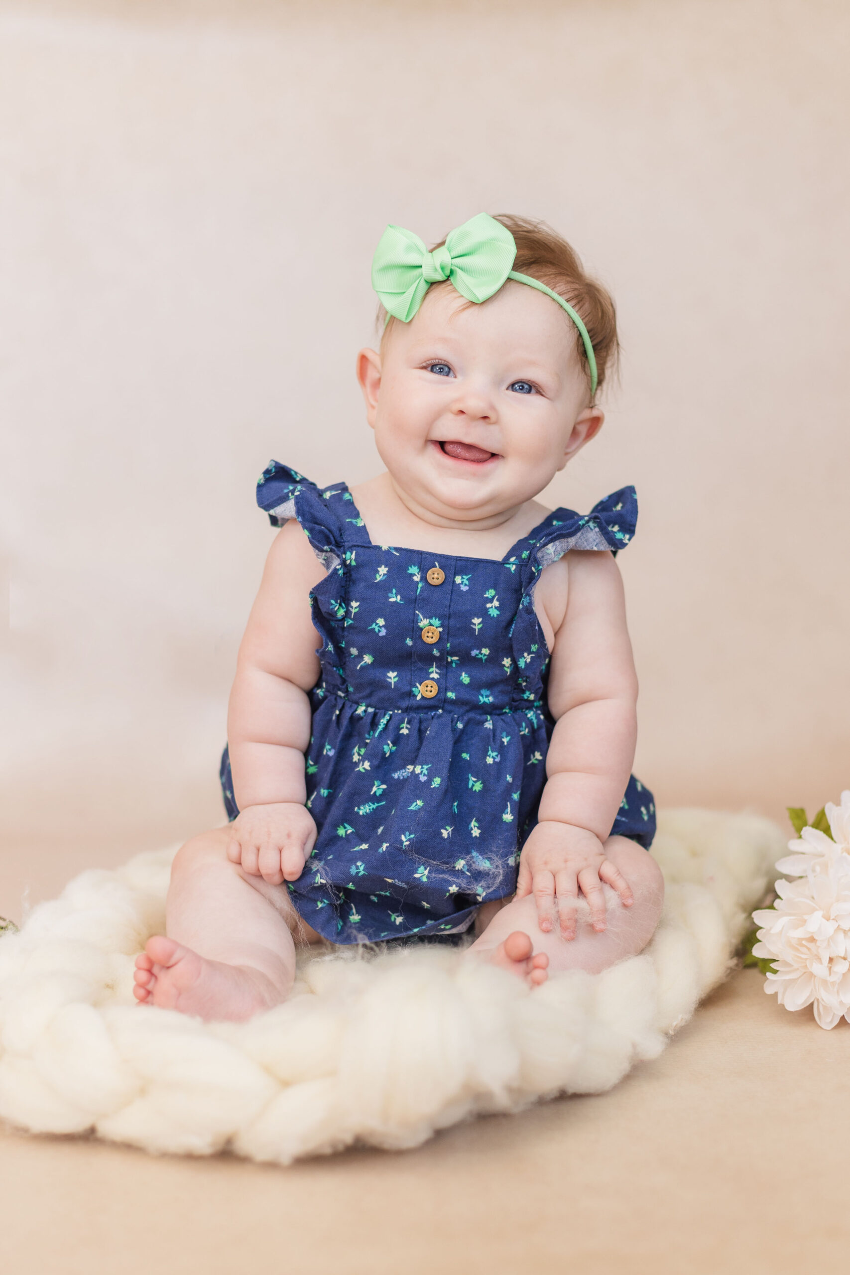 six months old girl posing for milestone portraits in Green Springs, Ohio