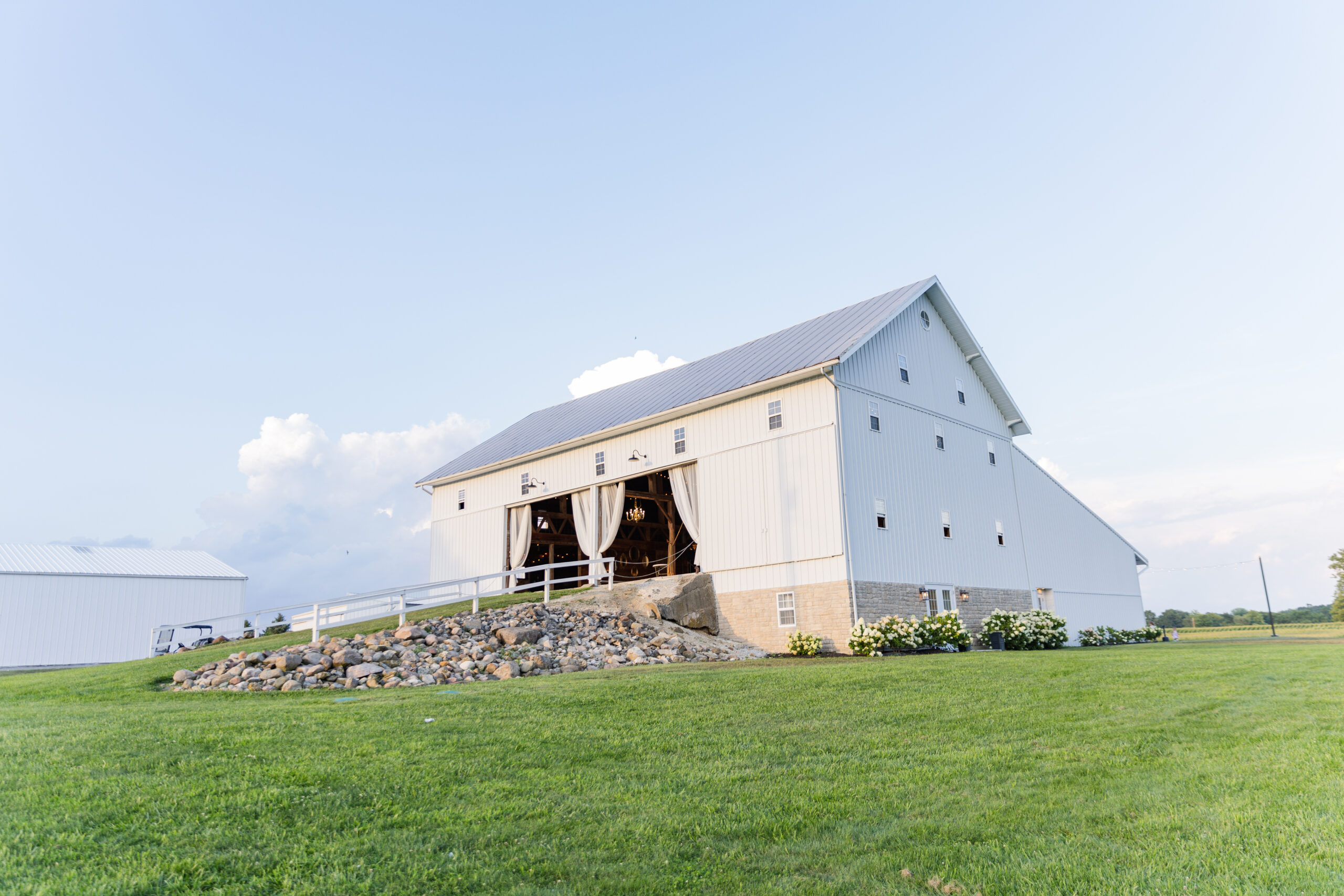 wide portrait of Arlington Acres white barn wedding venue in Ohio