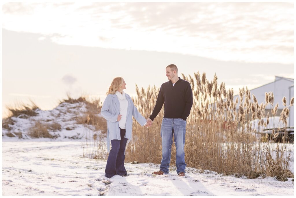 couple looking at each other standing in the snow on a farm in Fremont, Ohio